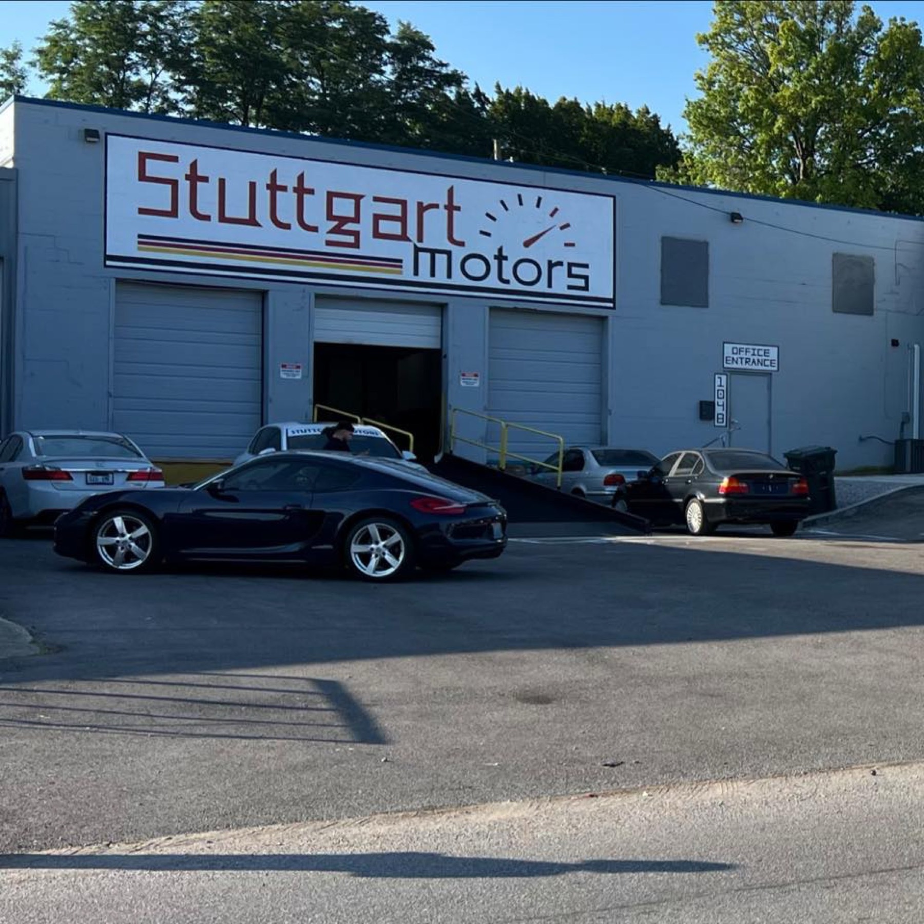 Customer cars parked outside Stuttgart Motors Eastland